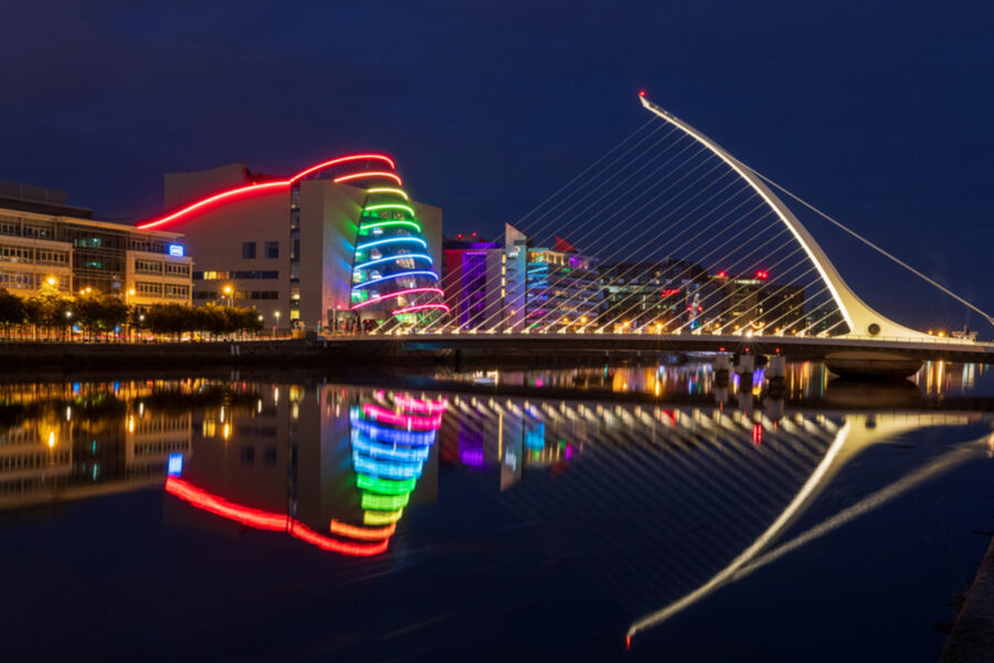 Reconnect in Ireland - Image here shows the exterior of the Dublin Convention Centre and the Samuel Beckett Bridge at night.
