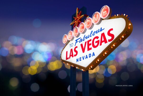 Vegas will play host to the 2023 IRF Education Invitational. This is a photo os the Welcome to Fabulous Las Vegas Nevada sign with a blurred background of city lights. Photo is by LPETTET | Canva.