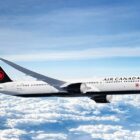 Air Canada has ordered more Dreamliner airplanes from The Boeing Company. This is an image of a Dreamliner in Air Canada livery flying above the clouds against a blue sky. Photo courtesy of Air Canada.