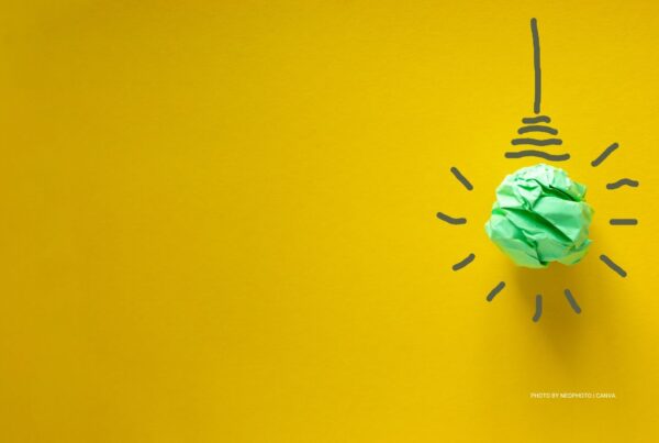 This is a stock image of a light bulb made from crumpled green paper on a bright yellow background. Photo by Dzmitry Dzemidovich | Canva.