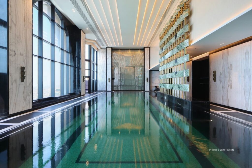 This is an image of the 26-meter pool at the Waldorf Astoria Doha West Bay, which opened in January 2024. Photo © 2024 Hilton.