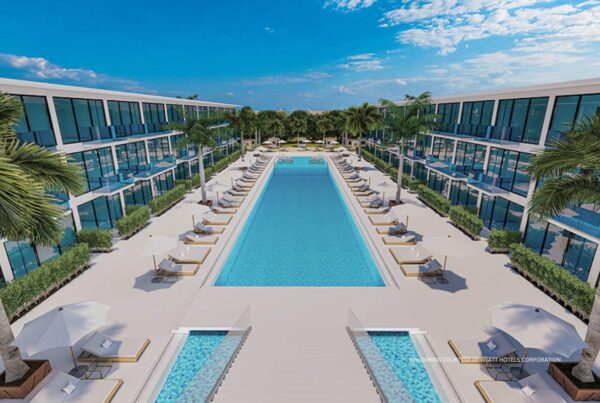 This image is a rendering of the poolscape at Cas en Bas Beach Resort in St. Lucia, which will open in late 2024 as part of the Destination by Hyatt brand. Rendering courtesy of Hyatt Hotels Corporation.