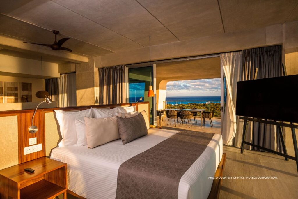 This is an image of a guestroom at Hyatt Vivid Grand Island, which opened April 1, 2024 in Cancun, Mexico. Photo courtesy of Hyatt Hotels Corporation.