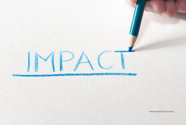 Impact is the driving force behind IMEX Frankfurt 2024's education program. This is a stock photo showing the word "impact" written in capital letters with a blue pencil. Photo by Melodija | Canva.