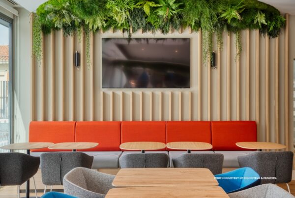 This is an image of part of the lobby of the Holiday Inn Express Madrid Airport in Spain, an inaugural member of IHG's Low Carbon Pioneers program. Photo courtesy of IHG Hotels & Resorts.