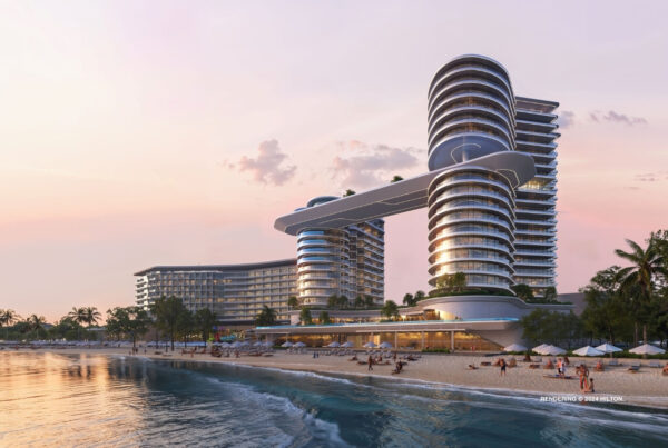 This image is a rendering of the exterior of Hilton Marjan Island Beach Resort & Spa, which is expected to open in Q4 2026 in Ras Al Khaimah, United Arab Emirates. Rendering © 2024 Hilton.