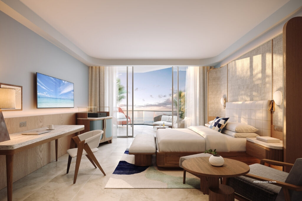 This is rendering of a guestroom in The Westerly, the new tower at Hilton Aruba Caribbean Resort & Casino, opening early 2026. Rendering © 2025 Hilton.