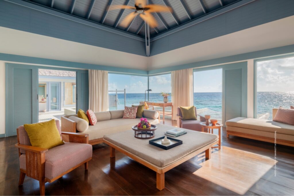 This is an image of the living room in an overwater villa at The Halcyon Private Isles Maldives, Autograph Collection, which opened in October 2025. Photo courtesy of Marriott International.