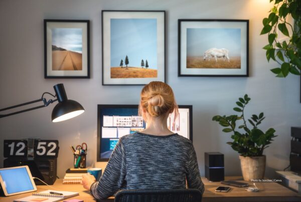 Survey results from study by Global DMC Partners reveal that opportunity to work from home contributes to work/life balance for planners. This image shows a young woman working at a desk in her home. Photo is by borchee | Canva.