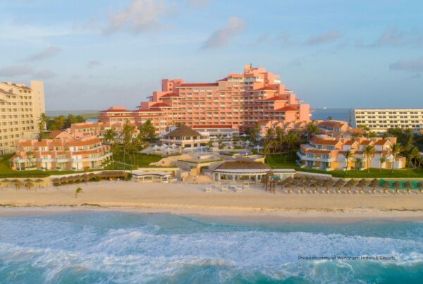 Wyndham Grand Cancun Resort & Villas is set to open in November 2022. This image is an exterior view of the 364-key property. Photo courtesy of Wyndham Hotels & Resorts.