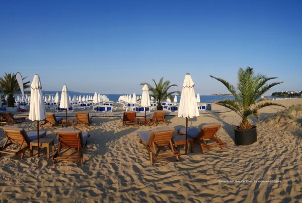 Bulgaria: This is an image of lounge chairs and umbrellas on Sunny Beach, a major sun destination in Bulgaria. Photo by vodniyaduh | Canva.