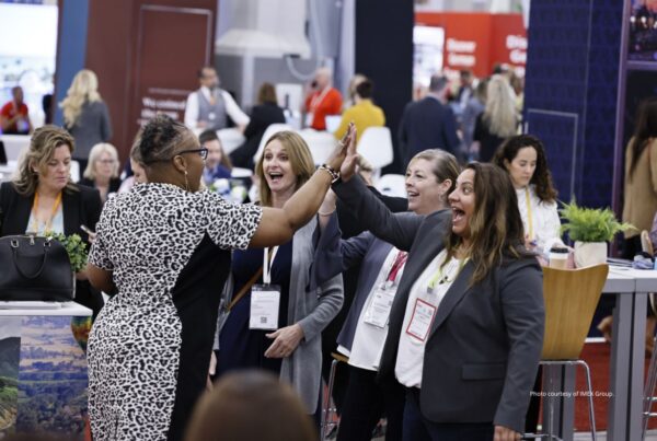 IMEX America releases post-show statistics. This is an image of buyers and suppliers greeting one another at IMEX America 2022. Photo is courtesy of IMEX Group.