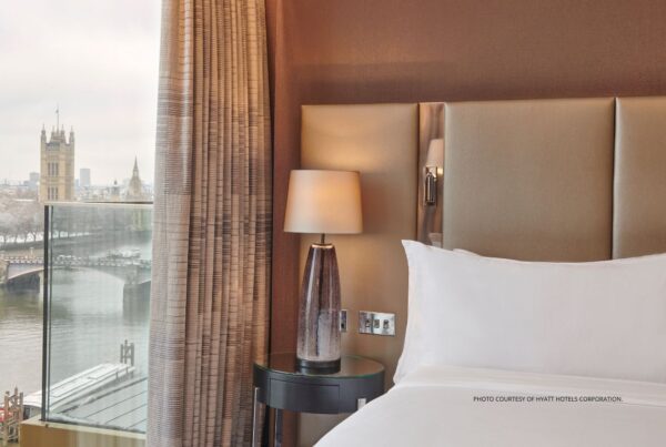 This is an image of the bed and view of the Thames River from a guestroom at the Hyatt Regency London Albert Embankment, which opened January 12, 2023. Photo courtesy of Hyatt Hotels Corporation.