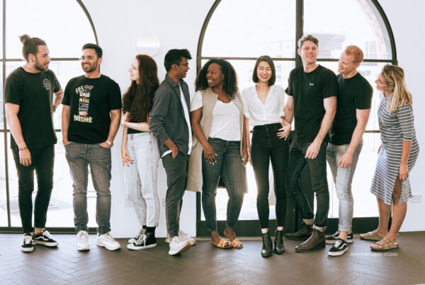 Awareness and compensation are two of the challenges the incentives industry faces in recruiting talent. This is a stock image of nine Gen Z-aged men and women against round windows. Photo by Canva Studio.