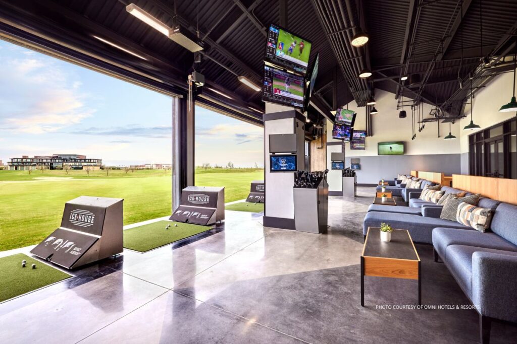 Omni PGA Frisco Resort opened May 2023. This image shows The Ice House restaurant with hitting bays overlooking the Toptracer driving range. Photo courtesy of Omni Hotels & Resorts.