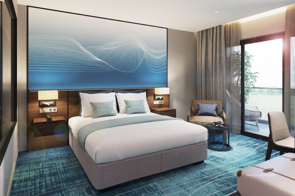 Hilton Garden Inn Da Nang opened in May 2023 on My Khe Beach, approximately 4 kilometers from the Vietnamese city's center. This image shows a king bed guestroom at the hotel. Photo © 2023 Hilton.