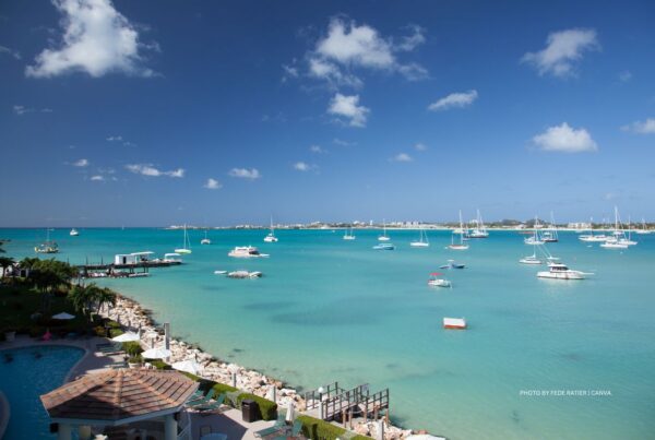 St. Maarten Tourism Board appoints VoX International as its Canadian representative on June 20, 2023. This is a stock image of a beach and boats off the island of St. Maarten. Photo by Fede Ratier | Canva.