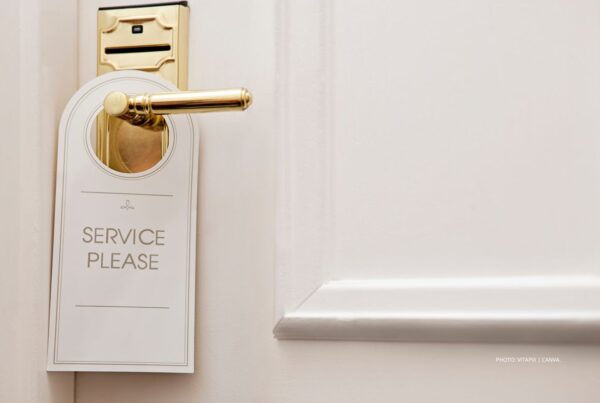 New IRF study (July 2023) reports demand for incentive travel is strong, but suppliers face challenges in meeting program expectations. This image is a stock photo of a Service Please sign on a hotel room door. Photo by vitapix | Canva.