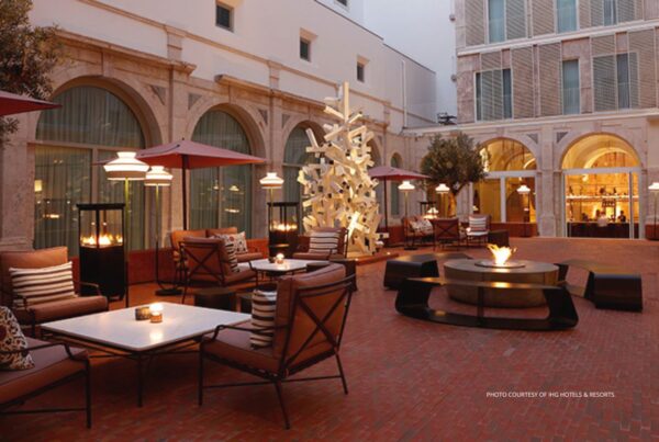 Convent Square Lisbon has joined IHG's Vignette Colletion. This is an image of the hotel's open-air cloister with seating around a fire-pit. Photo courtesy of IHG Hotels & Resorts.