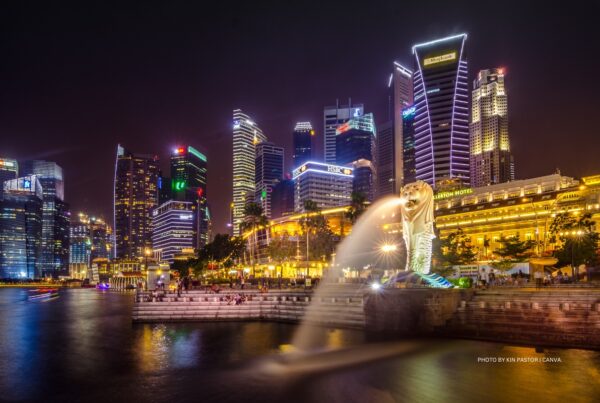 This is a stock image of part of Singapore's skyline at night. Photo by Kin Pastor | Canva.