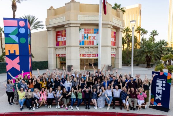 This is an image of the IMEX America staff in front of the Mandalay Bay Convention Center in Las Vegas, Nevada. Photo courtesy of IMEX Group.