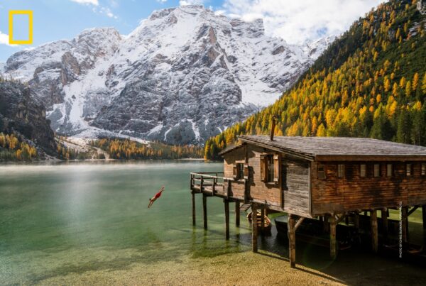 The Dolomites, Milan, Italy: Sports fans heading to the 2026 Winter Olympics, hosted primarily in Italy's Dolomite Mountains, should consider exploring beyond the venues to take in picturesque scenery such as Lago di Braies (Lake Braies) in the Tyrol. Photo by Chris Burkard, Verb Photo.