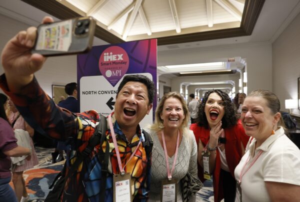 Statistics show solid attendee growth at IMEX America 2025. This image shows a group of attendees reuniting at the show. Photo courtesy of IMEX.