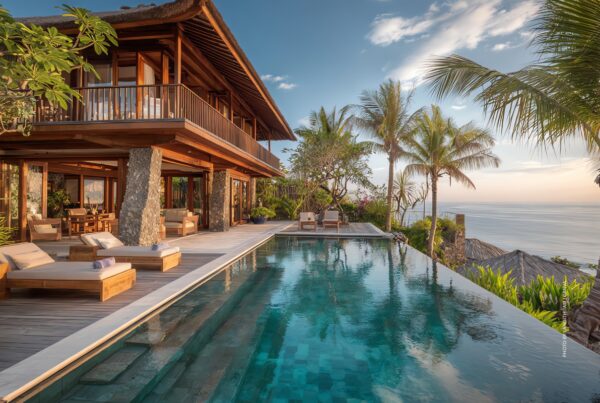 This is a stock image of the exterior of a luxury villa in a tropical destination with an infinity pool overlooking the ocean. Photo by langithitam | Canva.