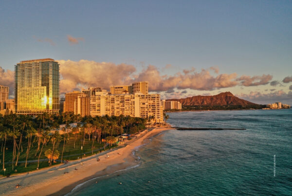 This is an image of the beach and Ka Laʻi Waikīkī Beach, LXR Hotels & Resorts. Photo © 2026 Hlton.